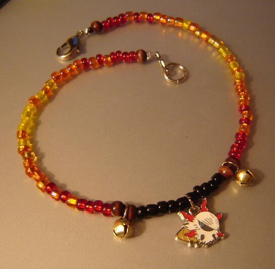 Ankle bracelet with Larvesta charm and bells